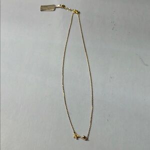 Elegant Gold plated necklace with cz x and bar